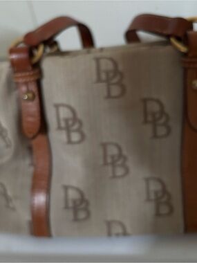Dooney & Bourke Beige Logo Jacquard Duffel with Brown Leather Trim